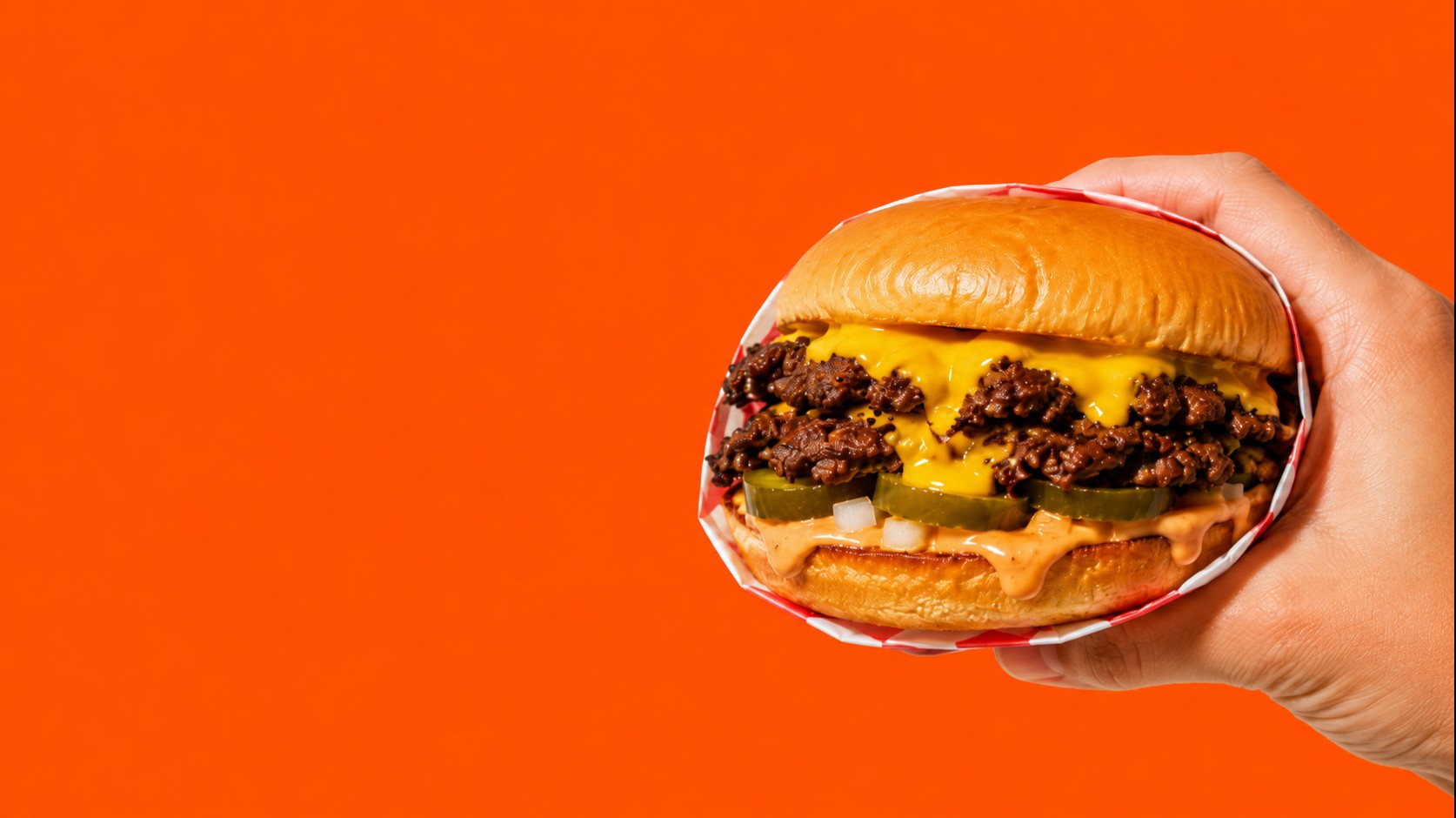 Halal smash burger with melted cheese and crispy edges at Smashville Burger in Oakland, CA